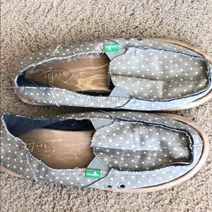 Sanuk slip on shoe with blue and white polka dots